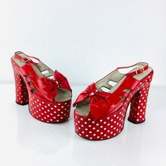 Vintage 1970s Red & White Polka Dot Platforms super tall platforms! ankle strap with buckle open toe with big bows cut outs at each side red patent leather over white for a polka dot effect by Gasuccio & Scalera made in Italy great vintage condition, very minor wear -  slight yellowing under to polka dots under heel appx size - 7.5 9.25 along insole 5.5 tall heel platform 2.5 at front platform 3 wide All sales are final Retro Party Heels With Bow, Retro Party Heels With Red Sole, Retro Platform Sandals For Party, Vintage Patent Leather Party Heels, Vintage Patent Leather Heels For Party, Retro Patent Leather Heels For Evening, Retro Patent Leather Evening Heels, Retro Evening Heels With Buckle Closure, Vintage Heels With Bow For Party