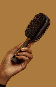 What it is: A double-sided Bristle Brush that polishes and refines strands.Who it's for: Ideal for curly, coily and tight hair textures.What it does: The 2-in-1 brush features nylon bristles to finesse flyaways and boar bristles to stick tighter styles. The lightweight brush gently polishes and refines strands. How to use: Use the brush on wet or dry hair to smooth hairstyles. Use as desired. 2.95" x 1.77" x 8.66" Premium boar bristles/nylon fibers/ABS/rubber Imported Curly Brush, Smooth Hairstyles, Smoothing Brush, Curly Hair Brush, Best Hair Brush, Pattern Beauty, Black Hair Updo Hairstyles, Round Hair Brush, Scrub Corpo