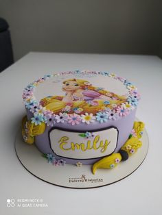 a birthday cake decorated with an image of a princess