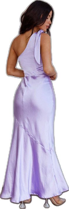 a woman in a purple dress is standing with her back to the camera and she has one hand on her hip