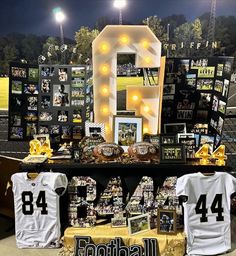 the football jersey is on display in front of some signs and lights that spell out number forty