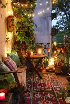 an outdoor patio with potted plants and lights