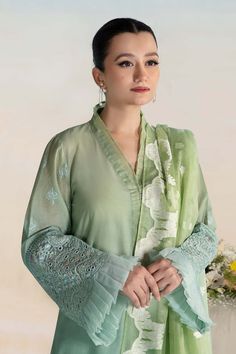 Classic Mint Green Maria B Luxury Formal Pakistani Salwar Suit has an alluring gold shade that will give you a head-turning look on the big day. Delivery: 7 Business Days Detailed Description: SKU: PB688 Detailing: Embroidery, Threads, Sequins, Motifs, Stones Color: Mint Green Fabric: Organza, Chiffon, Net Design: Fully Embellished Dress with Embroidery Event: Party wear, Festive Formal Green Salwar Kameez With Sheer Dupatta, Green Organza Sets For Formal Occasions, Elegant Churidar With Sheer Dupatta For Formal Occasions, Pista Green Unstitched Organza Suit For Wedding, Pista Green Organza Unstitched Suit For Wedding, Green Georgette Formal Sets, Green Georgette Sets For Formal Occasions, Wedding Raw Silk Set With Chikankari Embroidery, Green Organza Dupatta For Formal Occasions