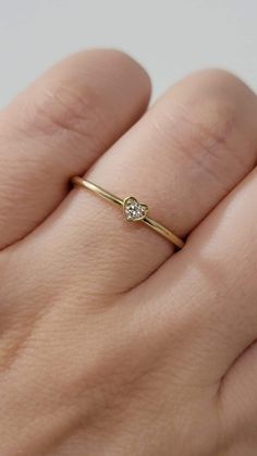 Diamond Heart-Shape Ring, Tiny 2MM Diamond Ring Women, Dainty Minimal Diamond Ring, Promise Ring, 14k Gold Stackable Ring, White, Rose Gold  Made in NYC - Custom Gold Color: Rose Gold, Yellow Gold, White Gold, in 14k  - Shank Width: 1.3mm - Diamond Shape: heart shape  - Number of Stones: 1 - Diamond Size: 2.2 mm - Total CTW:0.04 Ctw   - Diamond Color-Clarity: G-H / SI - Setting Type: Prong Setting  - Finish: high polish  We use only CONFLICT-FREE MINED DIAMONDS. This ring can be made in any ring 14k Gold Heart-shaped Solitaire Ring, Heart-shaped Single Diamond Promise Ring, Heart-shaped Single Diamond Jewelry For Promise, Promise Heart Ring With Single Diamond, Elegant Stackable Heart Ring, Dainty Heart Shaped Birthstone Promise Ring, Dainty Heart-shaped Promise Birthstone Ring, Dainty Heart Birthstone Promise Ring, 14k Gold Heart Ring With Single Diamond For Promise