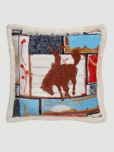 a decorative pillow with an image of a deer