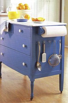 an old fashioned blue stove in the middle of a kitchen