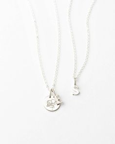 Make it all about U with this dainty letter necklace — an elegant initial pendant on a timeless chain! Create a custom look by adding extra letters, disks, or tags with our personalized add-ons, and style your initial necklace solo or stacked with your favorite chains. Each piece is hand-personalized in our studio and available in top-quality 14k gold fill and sterling silver. Dainty Initial Necklace, Initial Pendant, Letter Necklace, Add Ons, Initial Necklace, Gold Filled, Initials, Pendant Necklace, For Free