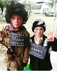 two children dressed up in costumes for halloween