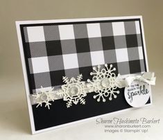 a black and white card with snowflakes on it