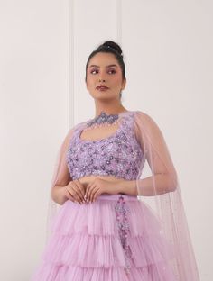 Lilac tulle ruffled lehnga with tonal 3D embellished floral blouse, complete with choker style duppatta and hangings. Net Blouse, Net Lehnga, Net Duppatta and Shantoon Lining Sequins and cutdana Round Lilac Color Cut Sleeves 3 Pieces Ruffled Choli For Party Wear, Ruffled Choli For Reception Party Wear, Semi-stitched Ruffled Lehenga For Reception, Party Wear Choli With Ruffles For Reception, Designer Party Wear Lehenga With Ruffles, Party Wear Lehenga With Ruffles For Reception, Anarkali Style Ruffled Lehenga For Party, Anarkali Lehenga With Ruffles For Party, Wedding Festive Floral Choli