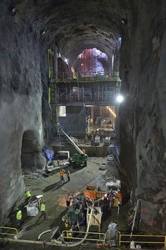 construction workers are working on the inside of a tunnel