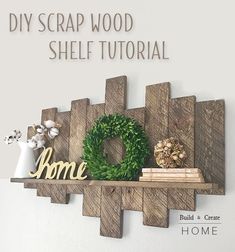 the diy scrap wood shelf is made from pallets and has a wreath on top