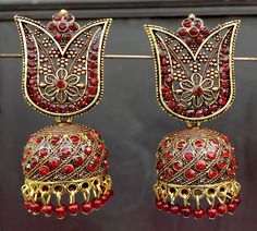 Perfect with ethnic & traditional wear. Fancy Party Wear Traditional Jhumki Earrings. Perfect gift for any occasion for yourself and your dear ones. It is advisable to store jewellery in a zip lock pouch (air tight pouch), keep away from water perfume and other chemicals and clean it with dry and soft cloth. Festive Temple Jewelry Jhumkas For Party, Bollywood Style Bridal Earrings With Stone Work For Navratri, Traditional Stone Work Jhumkas For Eid, Temple Jewelry Style Jhumkas With Latkans For Party, Bollywood Style Festive Jhumkas With Stone Work, Festive Bollywood Jhumkas With Stone Work, Bollywood Style Stone Work Jhumkas For Festive Season, Traditional Bridal Earrings For Navratri Party, Red Jhumkas With Intricate Design For Diwali