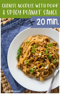 chinese noodles with pork and spicy peanut sauce in a white bowl on a woven placemat