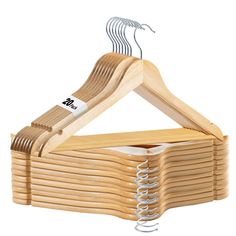 the wooden hangers are stacked on top of each other