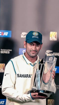 a man holding a trophy in his hand