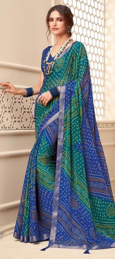 Cost Includes Saree,Unstitched BlouseFall & Edging Work Description: Blue, Green color Saree in Chiffon fabric with Bandhej, Border, Printed work Fabric: Chiffon Work: Bandhej, Border, Printed Color Family: Blue, Green Style: Classic, Rajasthani Occasion: Party Wear Saree Dimension: 530 Cm x 110 Cm ( L x W) Blouse Length: 80 Cm Approx Washing Instruction: Dry Wash Transitional Blue Georgette Blouse Piece, Blue Festive Blouse Piece For Transitional Season, Transitional Blue Blouse With Zari Work, Green Bandhani Print Traditional Wear, Blue Unstitched Blouse For Eid, Unstitched Blue Blouse Piece With Self Design, Blue Semi-stitched Blouse Piece For Festivals, Blue Blouse Piece With Cutdana For Festivals, Blue Traditional Wear For Navratri