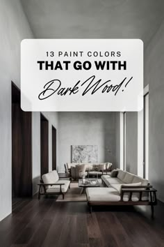 a living room with white couches and wooden floors in the background is a large sign that says, 13 paint colors that go with dark wood