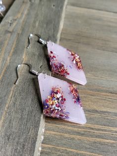 Beautifully bold and colorful pastel pink resin earrings, beautifully designed to be lightweight and dazzling with silver metals. Stylish geometric earrings with resin shapes, perfect statement accessories ♡ Be sure to check out the RED EARRINGS section at EarringsbyLCreations for all beautiful red colored earrings available! https://www.etsy.com/shop/EarringsByLCreations?section_id=28420977 Made with quality materials and always nickel and lead free metals. Naturally colorful jewelry made by ha Pink Pierced Earrings As Gift, Pink Resin Dangle Jewelry, Pink Party Earrings With Ear Wire, Pink Hypoallergenic Jewelry For Parties, Pink Hypoallergenic Party Jewelry, Pink Resin Drop Earrings, Pink Resin Earrings For Party, Colored Earrings, Earrings Resin