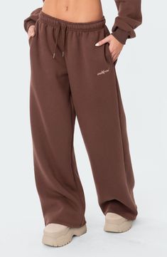 Let 'em know you're here for the drama in cotton-blend sweatpants fashioned with a low rise and wide leg. 50% cotton, 50% polyester Machine wash, line dry Imported Sporty Brown Pants, Wide Sweatpants, Sweatpants Style, Wide Leg Sweatpants, Belly Chain, Black Friday Sale, Cropped Hoodie, S Models, Model Height