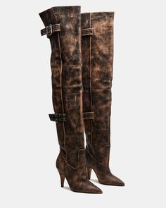 Expertly crafted, the BADDIE boot is both edgy and practical. Made with a pointed toe and buckle detail, these over-the-knee heeled boots offer a unique touch to any outfit. Elevate your style with these statement boots. 3.5 inch heel height Size 6 measurements: 16.5 inch shaft circumference, 22 inch shaft height Size 8 measurements: 17.25 inch shaft circumference, 22.5 inch shaft height Size 10 measurements: 18 inch shaft circumference, 23 inch shaft height Leather upper material Vegan leather Statement Boots, Resale Clothing, Open Toe Boots, Steve Madden Boots, Dress Loafers, Leather Socks, 5 Inch Heels, Spring Looks, Spring Tops