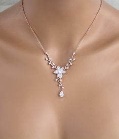 "Dainty Rose gold Bridal backdrop necklace and earrings set. Created in a lovely vine floral design that sparkles with Swarovski Pure Brilliance stones - Necklace measures 16 inches and extends to 18 inches - Backdrop measures 9 inches - You can choose a removable backdrop option in the drop down menu. This gives you an option to be able to wear the necklace alone without the backdrop. - Earrings dangle 1-3/8\" - Rose gold finish - Swarovski Pure Brilliance stones - Nickel free - Available in ro Bridal Backdrop Necklace, Rose Gold Bridal Earrings, Backdrop Necklace, Gold Bridal Necklace, Backdrops Necklace, Bridal Earrings Drop, Gold Bridal Earrings, Rose Gold Bridal, Necklace Rose Gold