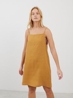 DEVON is a square neck strap mini linen dress which combines modern minimalism with a breathable fit, ideal for warm climates and summer events. Its sophisticated square neckline and a strap design make it versatile for both casual days and elegant evenings. DETAILS - Square neckline - Spaghetti straps - Mini length - 100% midweight European linen fabric - Cut and sewn to order just for you in our studio COLOR - Yellow Honey, you can also choose other colors above - Fabric samples are available Casual Mini Dress With Square Neck And Adjustable Straps, Casual Mini Dress With Adjustable Straps And Straight Neckline, Summer Sundress With Adjustable Straps And Straight Neckline, Summer Mini Dress With Adjustable Straps And Straight Neckline, Casual Suspender Dress With Square Neck And Tie Straps, Casual Suspender Dress With Tie Straps And Square Neck, Casual Beach Suspender Dress With Square Neck, Summer Dresses With Adjustable Straps And Straight Neckline, Summer Sundress With Adjustable Straps