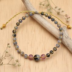 Balinese artisan Made Masna crafts a colorful yoga bracelet using obsidian, fluorite and sodalite, accented by gleaming 18k gold-plated brass beads. Set on golden metallic cords with an adjustable sliding knot closure, it offers both style and adaptability, making it a perfect fit for your daily yoga and meditation practice, casual outings and more. Gold Accent Jewelry, Yoga Pendant, Ear Cuff Jewelry, Sliding Knot Closure, Adjustable Sliding Knot, Meditation Bracelet, Jewelry Decor, Brass Beads, Yoga Bracelet