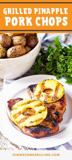 grilled pineapple pork chops on a white plate with potatoes and parsley