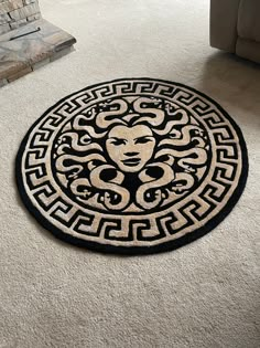 a black and white area rug with an image of a woman's face on it