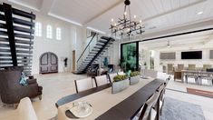 a dining room table with chairs and a chandelier hanging from it's ceiling