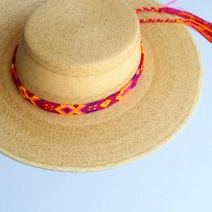 These Beautiful hat bands are carefully hand woven by Rosa in Chiapas,Mexico. Each band showcases a unique and colorful patterned design using traditional macrame techniques. Add a touch of handmade artistry to your hat collection today! Width 1” Length: 23 inches, not including fringe Fringe 9” each side , for an adjustable fit. Fits most hats Polyester yarn All items are shipped from US. All Mi Mundo Mexicano items are 100% handmade by artisans in Mexico. Each stitch and item is completely uni Bohemian Straw Hat With Flat Crown For Beach, Adjustable Straw Hat For Festivals, Adjustable Woven Straw Hat, Adjustable Woven Hat With Flat Crown, Bohemian Braided Hat Bands For Festival, Adjustable Woven Hats, Adjustable Woven Hats One Size, Adjustable One Size Woven Straw Hat, Adjustable One-size Straw Hat For Festivals