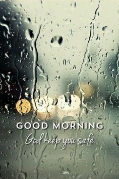 the words good morning are written on a rainy window