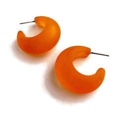 Orange Hoop Earrings With A Frosted Finish. This Style Hoop Is Called The Snail Shell Hoop & Is Made Of Vintage Matte Lucite. Each Measures Just About 1 Inch In Diameter & 13mm In Width At The Widest Point. Most All Earrings Are Made With Vintage Lucite Parts That Were Made In Rhode Island In The 1960's - Early 80's By Best Plastics. We Hand-Set Them With Surgical Steel Earring Posts And They Have Sturdy Surgical Steel/Acrylic Backings On Them As Well. Light-Weight & Fun To Wear. Orange Small Hoop Earrings For Summer, Summer Orange Small Hoop Earrings, Trendy Small Hoop Orange Earrings, Orange Small Hoop Earrings With Ear Wire, Orange Earrings For Everyday Summer Wear, Shell Hoop Earrings, Summer Board, Snail Shell, Surgical Steel Earrings