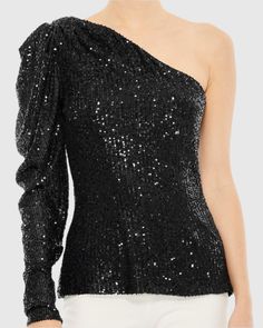 Dazzle at your next special occasion in our One Shoulder Puff Sleeve Sequin Top, a captivating choice designed to make you stand out. With its eye-catching sequin detailing and one-shoulder puff sleeve design, this top is a show-stopping statement piece that pairs elegantly with a chic skirt and statement earrings for a look that's sure to turn heads. Mac Duggal Sequin fabric (100% Polyester) One shoulder neckline Puff long sleeve Available in Black (Final Sale) Style #R26832 Final Sale - Item i Chic Skirts, Puff Long Sleeves, Mac Duggal, Sequin Fabric, Sequin Top, Sleeve Designs, Puff Sleeve, One Shoulder, Black Fashion