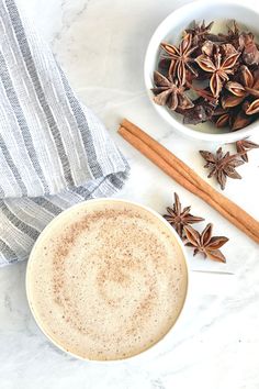 anisette with cinnamon sticks and star anisets on a marble table top