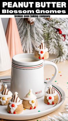 there are small cookies on the plate next to a mug