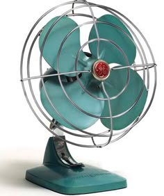 a small blue fan sitting on top of a metal stand in front of a white background