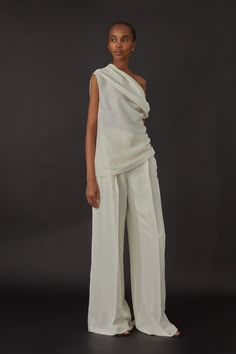 Wide-leg, pleat tailored trousers in Italian silk shantung fabric. Details include interior waistband curtain, belt loops and slash pockets. Fully lined in silk habotai. Wear it with Frida Top, Isabel Top or Luisa Blazer in the same fabric. White Tunic And Pants, Bridal Top And Pants, Asymmetrical Outfits For Women, White Silk Trousers, Party Two Piece Outfit, Greek Style Outfit, Off White Trousers Outfit, Silk Two Piece Outfit Pants, Wedding Pants Outfit