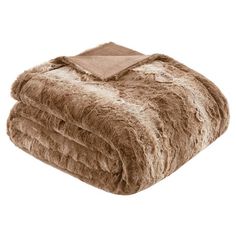 a brown blanket is folded on top of a white background