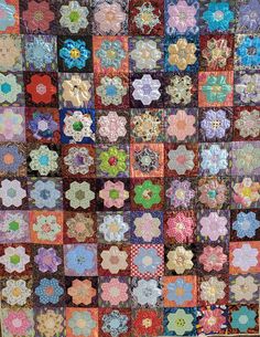 a quilt made with many different colors and designs on the front, side, and back