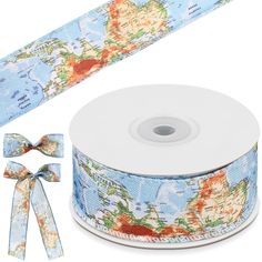 a roll of blue world map ribbon next to it's spool and bow