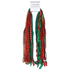 a red and green scarf hanging on a wall