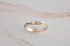 Create your own beautiful set of name rings to show off the people closest to your heart! So simply pretty! Our 3mm high quality 14k Gold-Filled band rings fit one date, name or word in your choice of font. Our rings stack beautifully together, so purchase up to 3 name band rings total for one finger. Please keep the total characters per ring to around 20 max. Up to 3 name ring bands with two spacers will fit on one finger, and we recommend sizing to the next whole size up if you are stacking 3 Simple Personalized Stackable Wedding Rings, 14k Gold Engraved Names Ring For Anniversary, Anniversary Stackable Rings With Names, Custom Name Stackable Rings In 14k Gold For Anniversary, 14k Gold Custom Name Engraved Ring For Promise, 14k Gold Engraved Ring With Custom Name For Promise, Custom Name 14k Gold Stackable Rings For Anniversary, 14k Gold Stackable Rings With Custom Name For Anniversary, 14k Gold Engraved Ring For Promise With Names