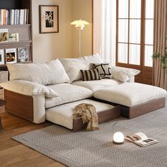 a living room filled with furniture and a book shelf