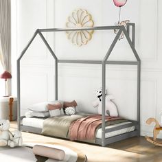 a child's bedroom with a bed, rocking horse and stuffed animals on the floor