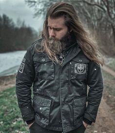 Grimfrost's 5 Year Anniversary Jacket! A unique jacket for the modern Viking that is inspired by the classic US Army M65 field jacket. Made in top quality peached twill, it can be worn over a hoodie or a t-shirt depending on the weather. We have given the jacket a vintage look with a Viking twist. A Grimfrost runic patch and a Raven Banner patch sits on the right upper arm. Our helmet design is printed across the left chest pocket. To top things off, we have given each wooden button a Younger Fu Winter Techwear For Adventure, Winter Techwear Outerwear For Adventure, Techwear Outerwear For Winter Adventure, Urban Style Parka For Winter Urban Adventures, Techwear Outerwear For Adventure In Fall, Winter Combat Utility Jacket For Outdoor Activities, Winter Cotton Techwear Utility Jacket, Combat Utility Jacket For Winter Outdoor Activities, Fall Techwear Outerwear For Adventure