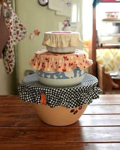 a stack of bowls sitting on top of a wooden table