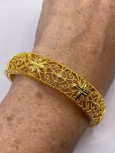 Vintage Bangle Bracelet Golden Bronze filigree  22k over bronze Indian wedding bangle  Fits a small to average wrist    All jewelry is shipped free in the US in a nice gift box.   Check out our over a THOUSAND great reviews Engraving is $4 per letter and is not always perfect depending on the piece. It can take a few days if the jeweler is busy. This is payable to Paypal Judithsltd@gmail.com Gold Filigree Bangle For Wedding, Ornate Gold Cuff Bracelet With Filigree, Ornate Gold Filigree Cuff Bracelet, Ornate Gold Cuff Bracelet With Intricate Design, Adjustable Gold Wedding Bracelet With Intricate Design, Ornate Gold Bracelet With Intricate Design, Wedding Filigree Bangle Bracelets, Adjustable Gold Bracelet With Intricate Design For Wedding, Ornate Gold Bangle With Intricate Design