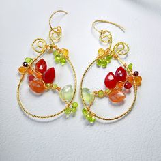 Indulge in the boho chic charm with these large teardrop multi gemstones earrings, featuring carnelian, sunstone, prehnite, citrine, garnet and peridot.  These handmade, colorful flower woven hoops make a unique gift for her. Perfect for any jewelry lover, these luxury gem wire-weaved earrings are a statement piece that blends whimsy with elegance. ▶️ Natural multi gemstone weaved earrings length - approx. 2.5 x 1.25 inch / 6,5x 3,2 cm ▶️ MATERIAL: ◾️ 18K gold plated textured wire and finish, ox Elegant Multicolor Handmade Hoop Earrings, Unique Wire Wrapped Dangle Jewelry, Bohemian Briolette Wire Wrapped Earrings, Bohemian Briolette Wire Wrapped Jewelry, Bohemian Jewelry With Natural Stones In Freeform, Bohemian Freeform Wire Wrapped Jewelry, Elegant Freeform Wire Wrapped Jewelry, Bohemian Briolette Gemstone Beads Jewelry, Bohemian Gemstone Beads Earrings